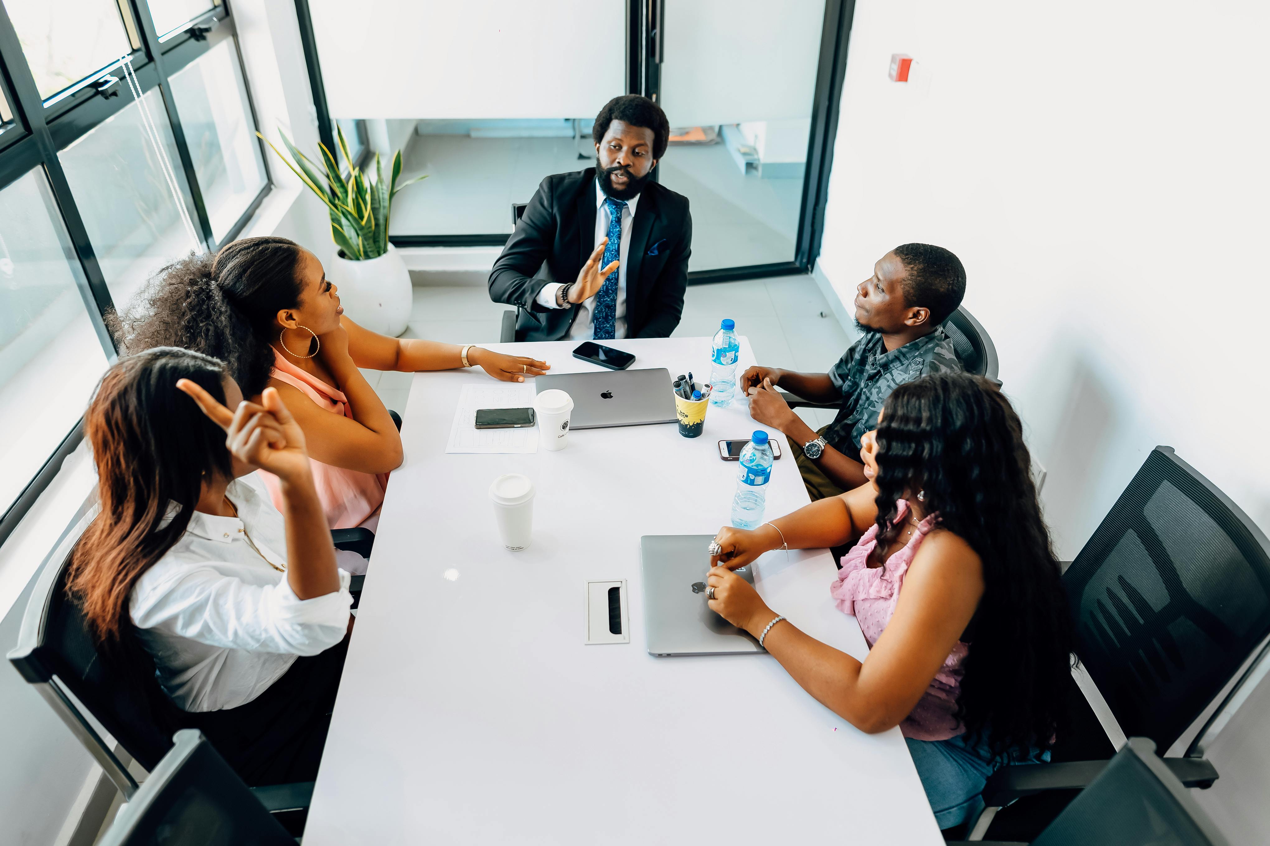 Diverse professional team meeting in modern E.A.D office